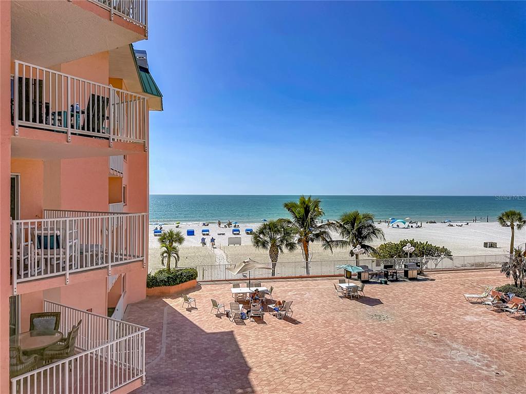 An entryway with tile flooring leads to a bedroom and a bathroom with a shower — 18400 GULF BOULEVARD UNIT 1312, INDIAN SHORES, FL