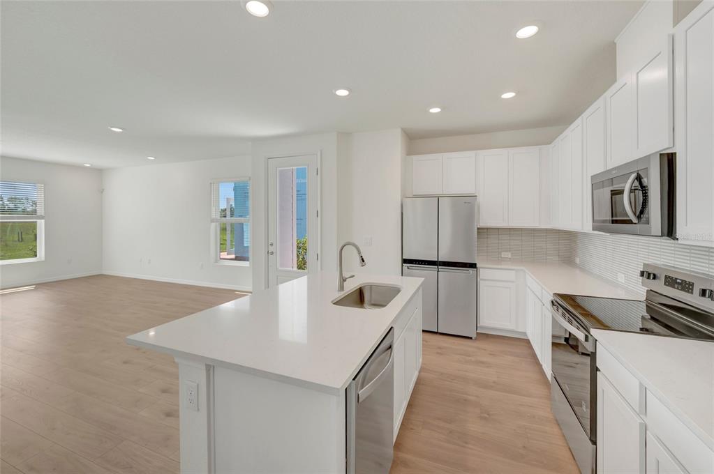 This is a floor plan of a residential second floor featuring three bedrooms and two bathrooms — 6418 JENSEN VIEW AVENUE, APOLLO BEACH, FL