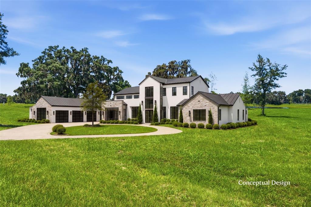 A conceptual design rendering of a modern farmhouse with stone accents and a metal roof — TBD (Lot 14-W) SW 138TH LOOP, DUNNELLON, FL