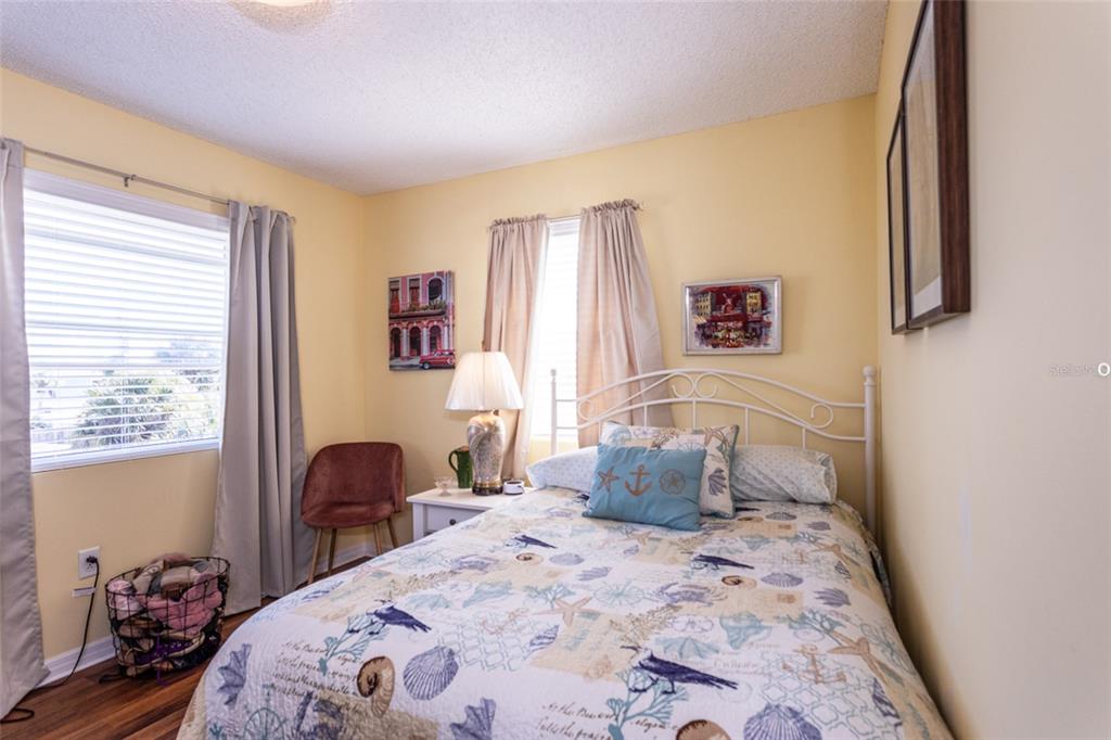 A kitchen features light wood cabinets, granite countertops, and bright turquoise walls — 44 FLAGLER DRIVE, PALM COAST, FL