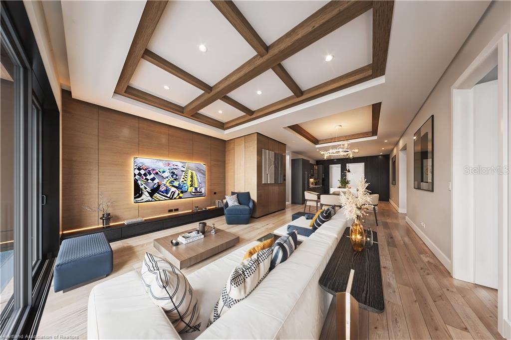 This is a rendering of a modern kitchen featuring a marble island and dark cabinetry — 8308 BLACK WOLF DRIVE, SEBRING, FL