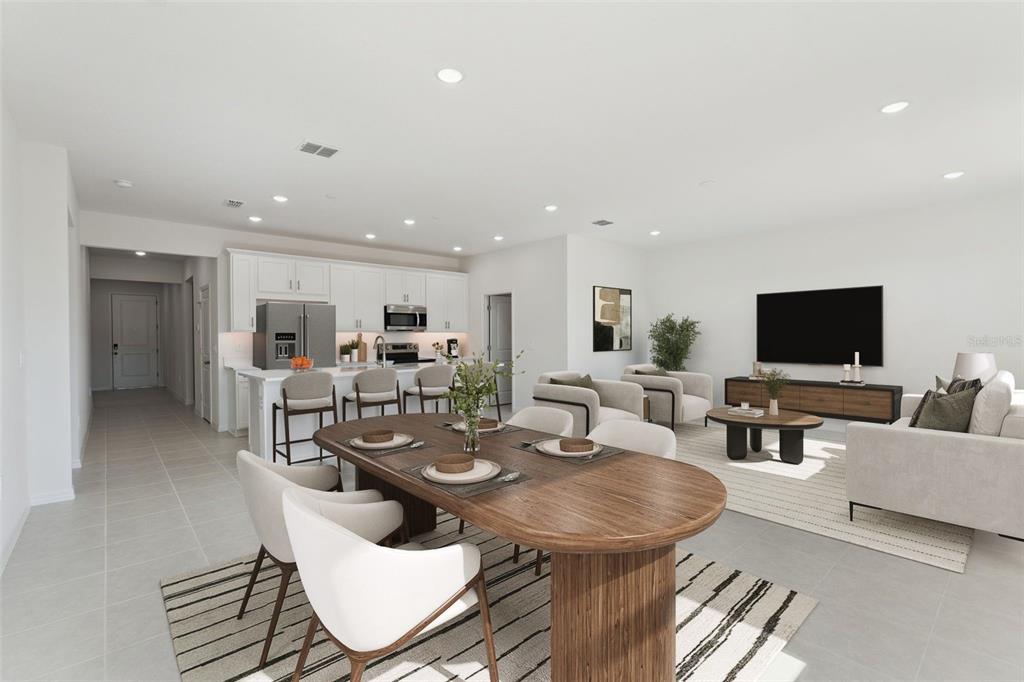 This is a digital rendering of an open-concept kitchen, dining area, and living room — 4275 DARBY COURT, EUSTIS, FL