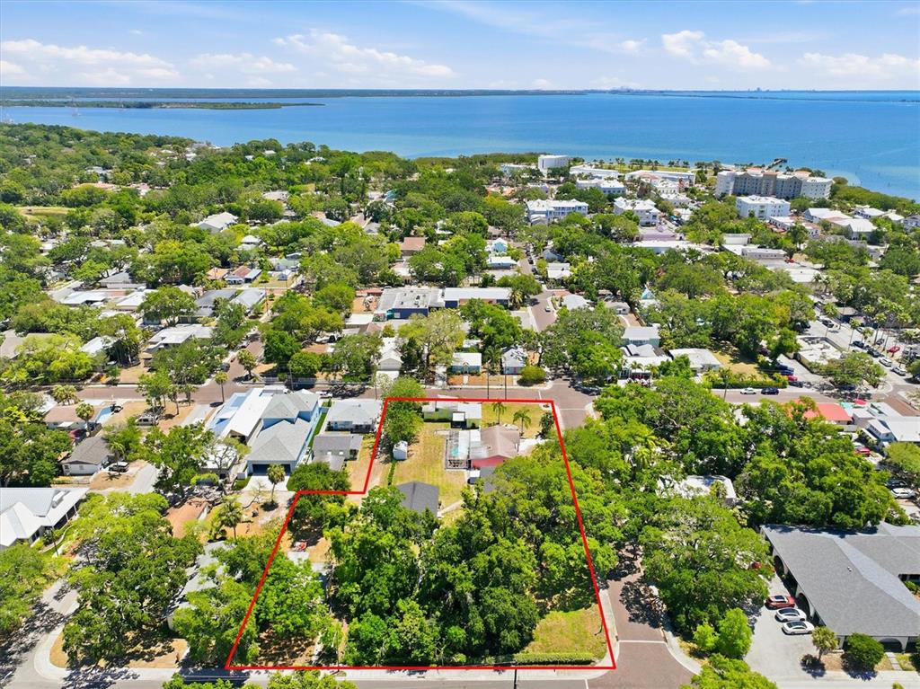 An aerial view shows a residential lot outlined in red within a coastal neighborhood — 2ND STREET N, SAFETY HARBOR, FL