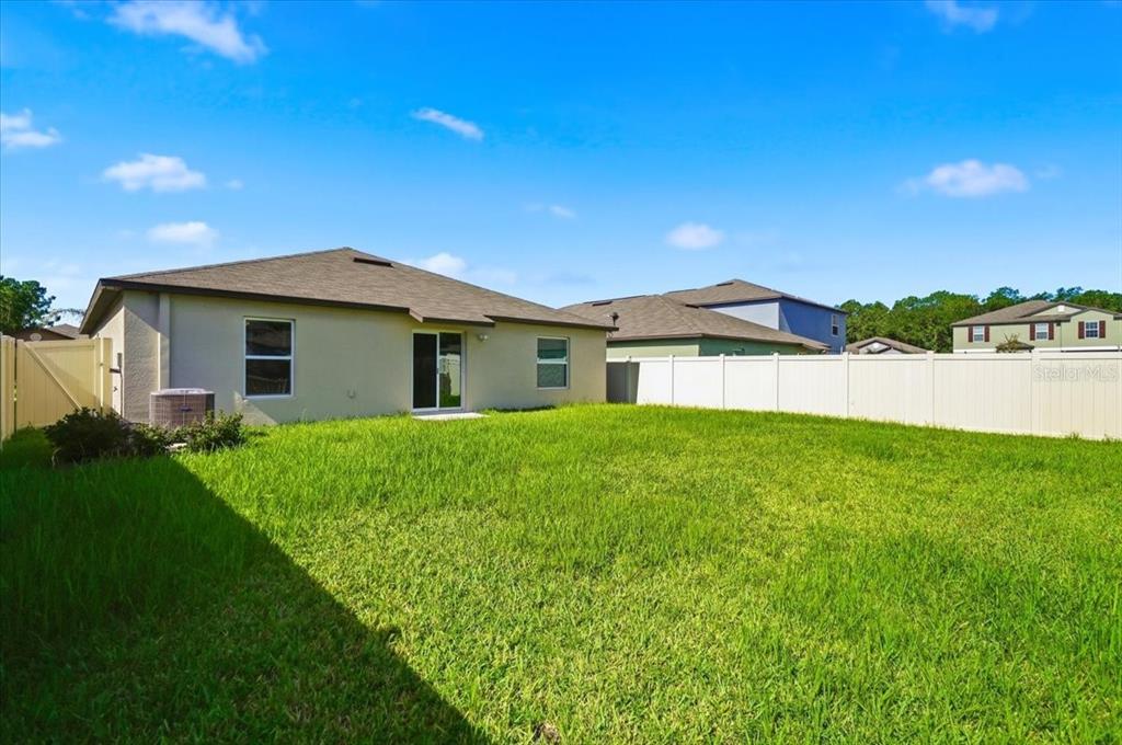 An aerial view shows a single-story suburban house with a brown shingled roof — 4316 TROTTERS WAY, LAKELAND, FL