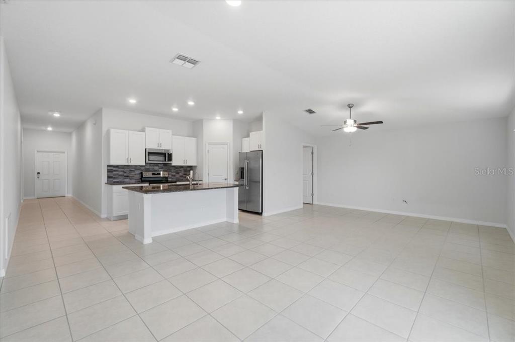 This aerial view shows a single-family home with a fenced backyard in a residential neighborhood — 4316 TROTTERS WAY, LAKELAND, FL
