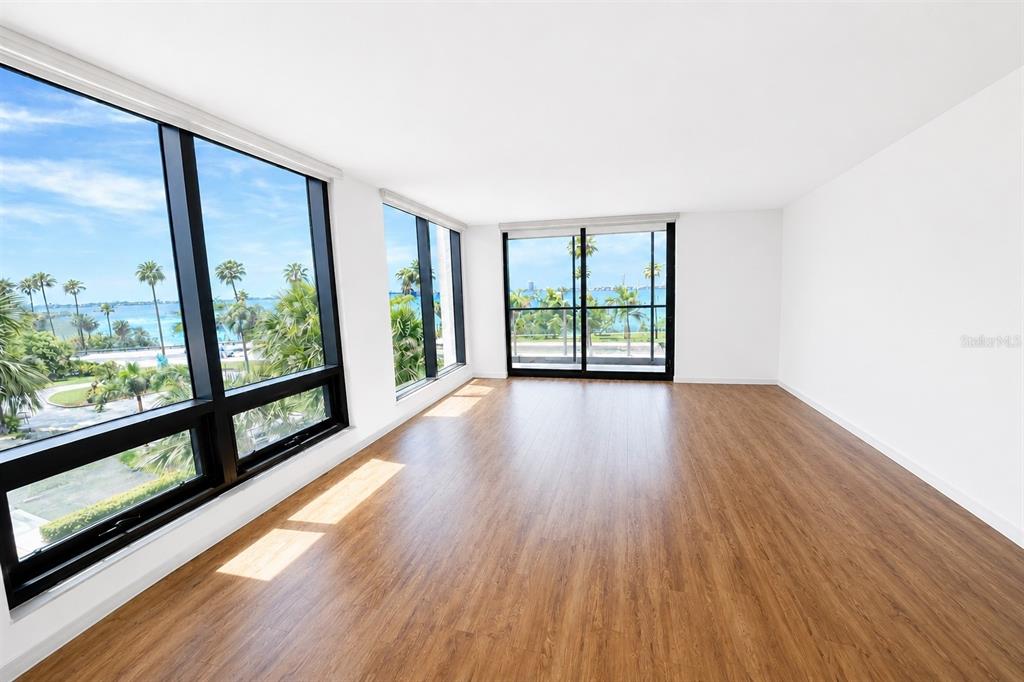 An aerial view of a waterfront city skyline featuring sailboats on the bay — 707 S GULFSTREAM AVENUE UNIT 307, SARASOTA, FL