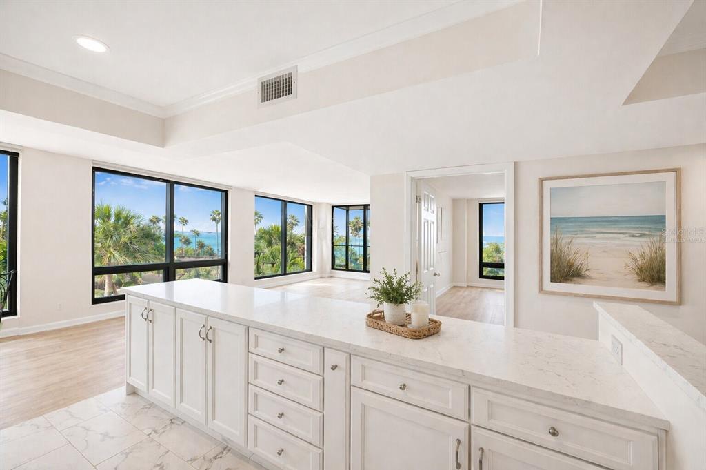 An aerial view shows a coastal city with high-rise buildings, a road, and a bay — 707 S GULFSTREAM AVENUE UNIT 307, SARASOTA, FL