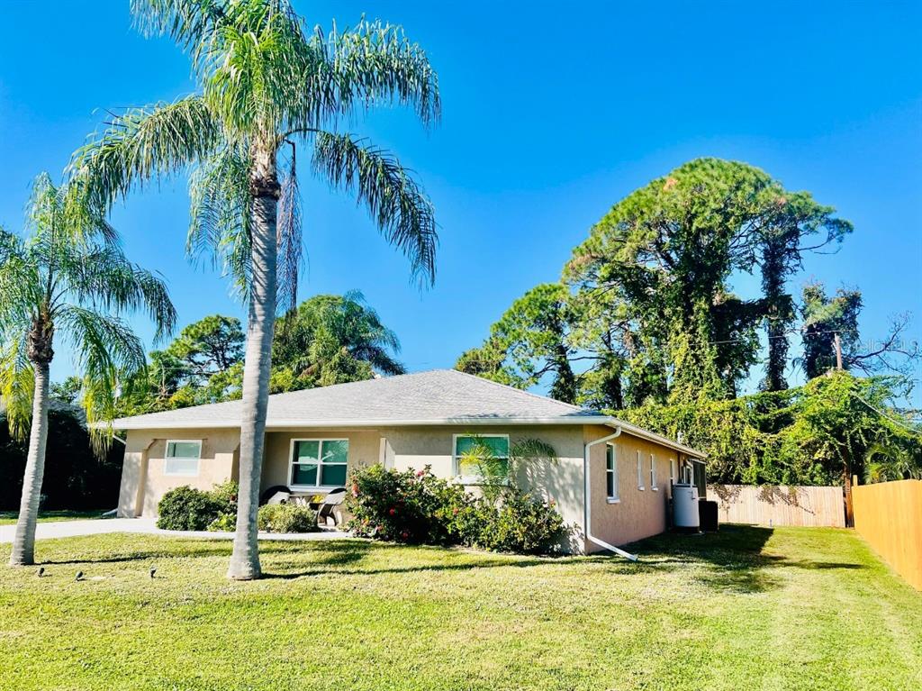 A swimming pool with a screened-in enclosure and a patio area in a backyard — 874 ACADIA ROAD, VENICE, FL