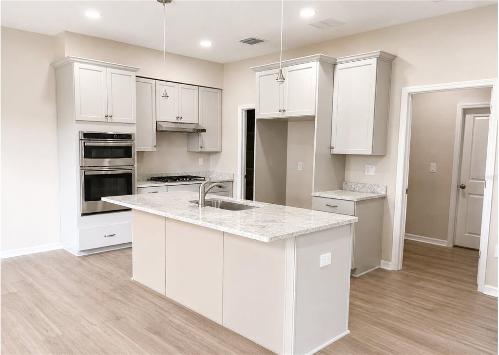 An empty room with beige walls, a ceiling fan, and an unfinished concrete floor — 411 SHANNON ESTATES COURT, PLANT CITY, FL
