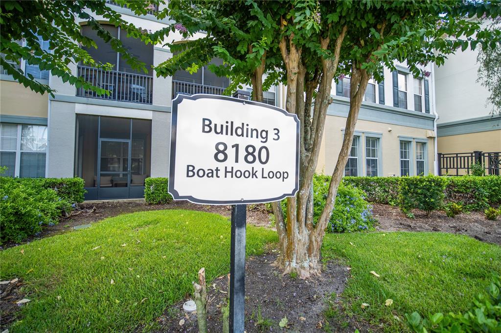 A sign identifying Building 3 stands in front of a multi-story apartment building — 8180 BOAT HOOK LOOP UNIT 102, WINDERMERE, FL