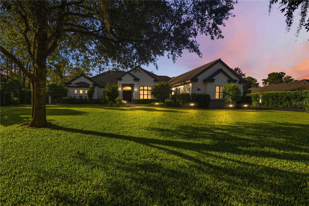 A screened-in patio features a swimming pool, paver flooring, and a wood-paneled ceiling — 21724 DEER POINTE CROSSING, BRADENTON, FL