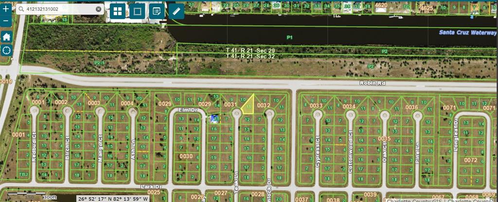 This is a satellite map showing a residential neighborhood with highlighted land parcels and streets — 32 TEAK LANE, PLACIDA, FL