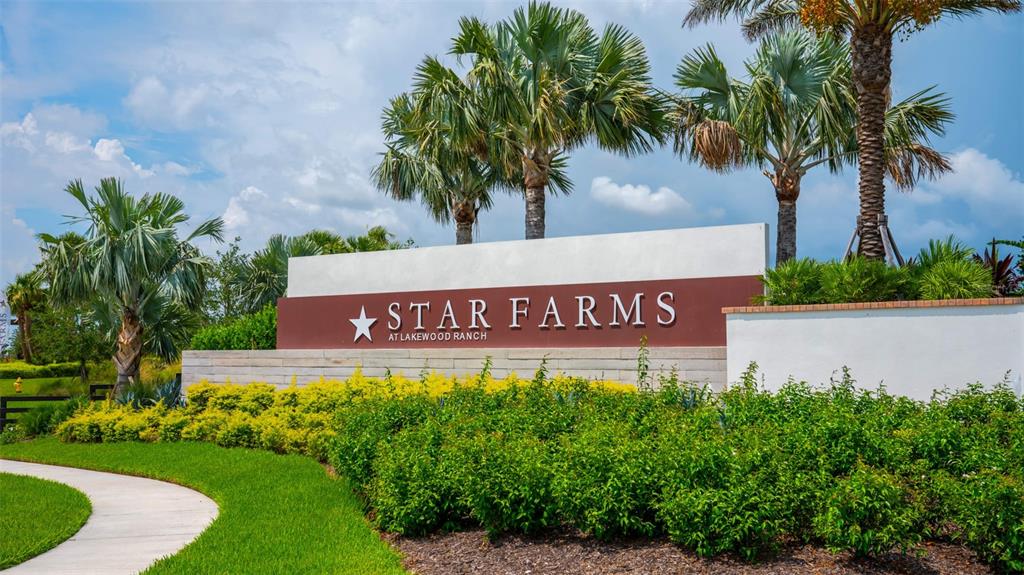 A sign for Star Farms at Lakewood Ranch stands behind landscaped bushes and palm trees — 3723 COUNTRY VIEW COURT, BRADENTON, FL