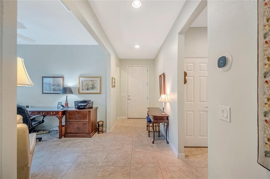 A tiled entryway leads to a front door, with an office space to the left — 9145 SW 70TH LOOP, OCALA, FL