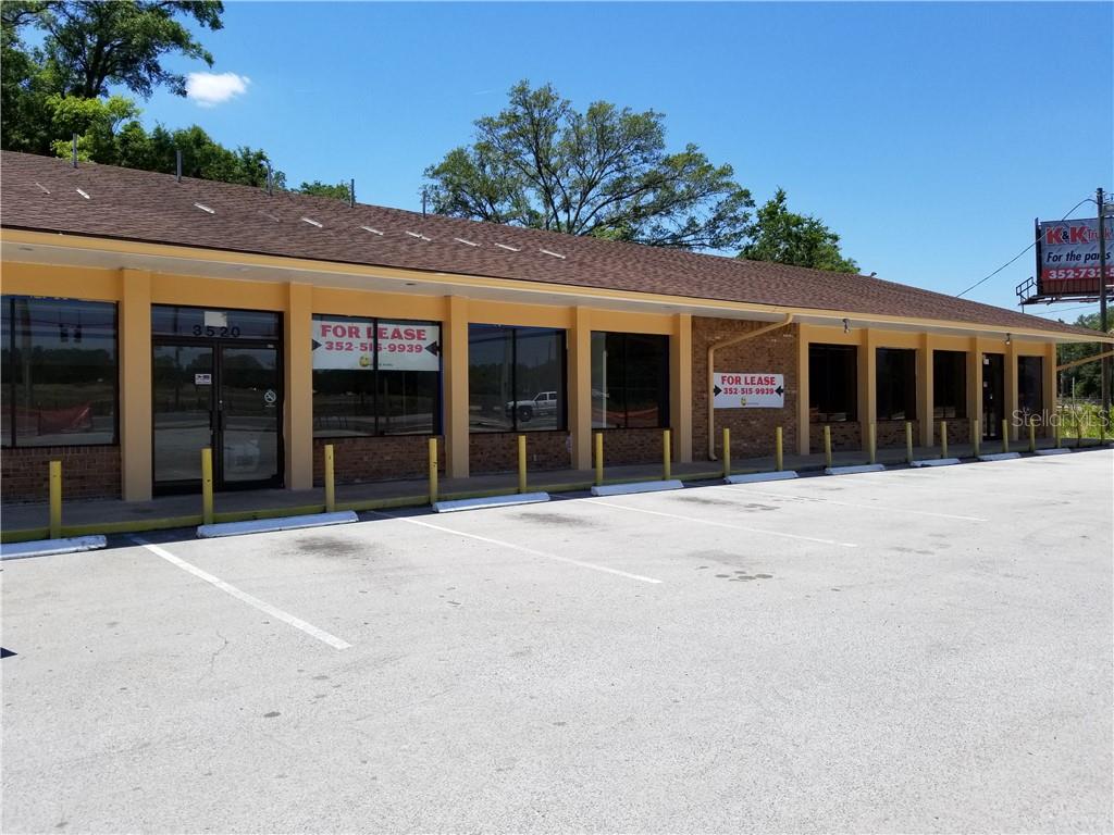 A single-story commercial strip mall building with a parking lot in front — 3520 W HIGHWAY 326 HIGHWAY, OCALA, FL