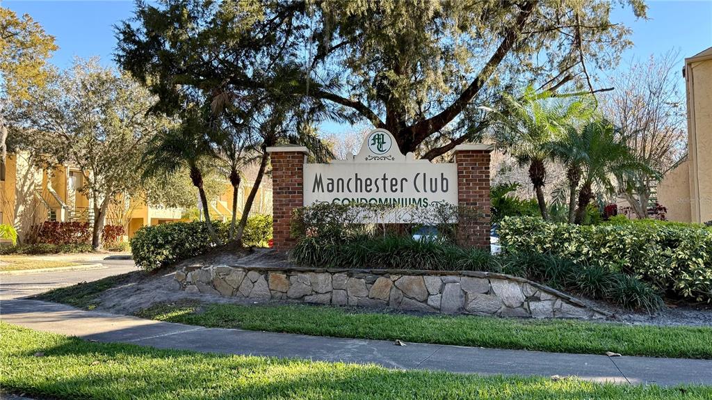 A kitchen features white cabinets, stainless steel appliances, a tiled backsplash, and light-colored tile flooring — 4368 S LAKE ORLANDO PARKWAY UNIT 203, ORLANDO, FL