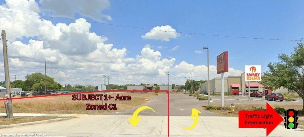 This exterior view shows a vacant lot next to a Family Dollar store — 648 N RIDGEWOOD DRIVE, SEBRING, FL