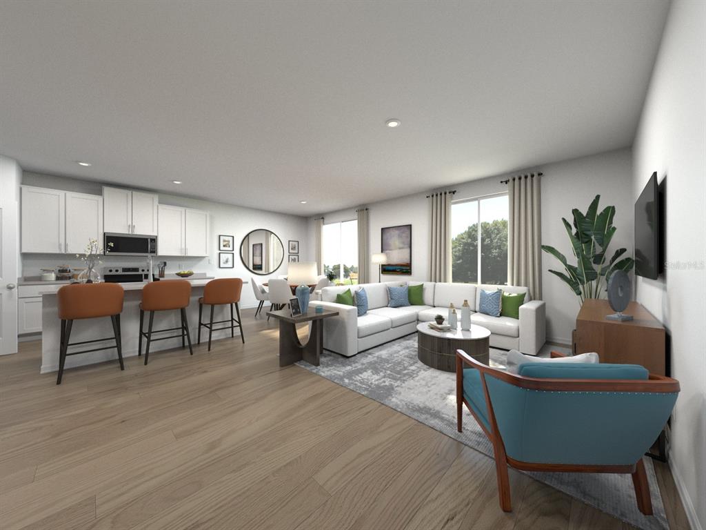 This rendering shows an open-concept living room and kitchen with light wood floors and furniture — 1756 FOREST RUN LANE, AUBURNDALE, FL