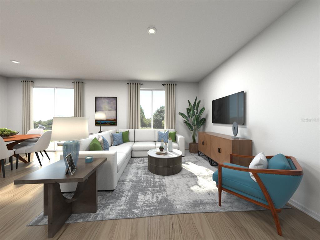 This is a digital rendering of a modern living room with a sectional and accent chair — 1756 FOREST RUN LANE, AUBURNDALE, FL