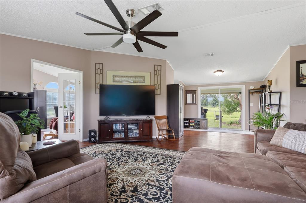 This is a floor plan showing a three-bedroom, two-bathroom home with an attached garage — 28651 TUPPER ROAD, WESLEY CHAPEL, FL
