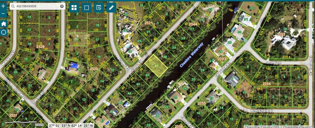 This is a satellite map showing a vacant residential lot highlighted in yellow near a waterway — 332 CORY STREET, PORT CHARLOTTE, FL