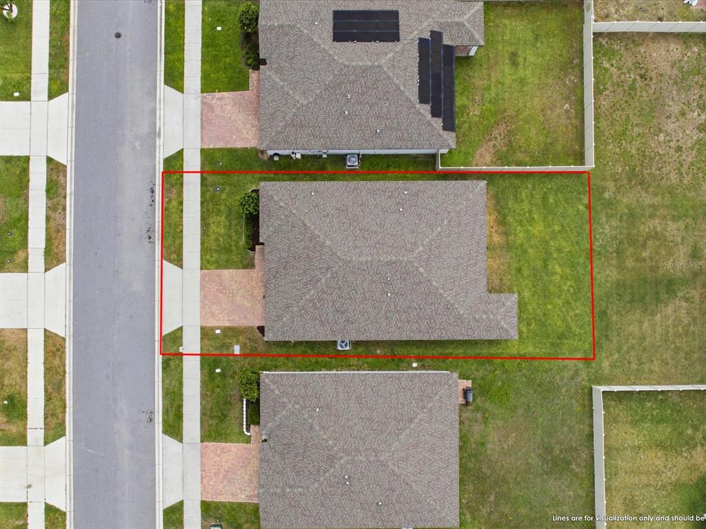 An aerial view shows a single-family house with a red outline marking its property boundaries — 125 ANDREAS STREET, WINTER HAVEN, FL