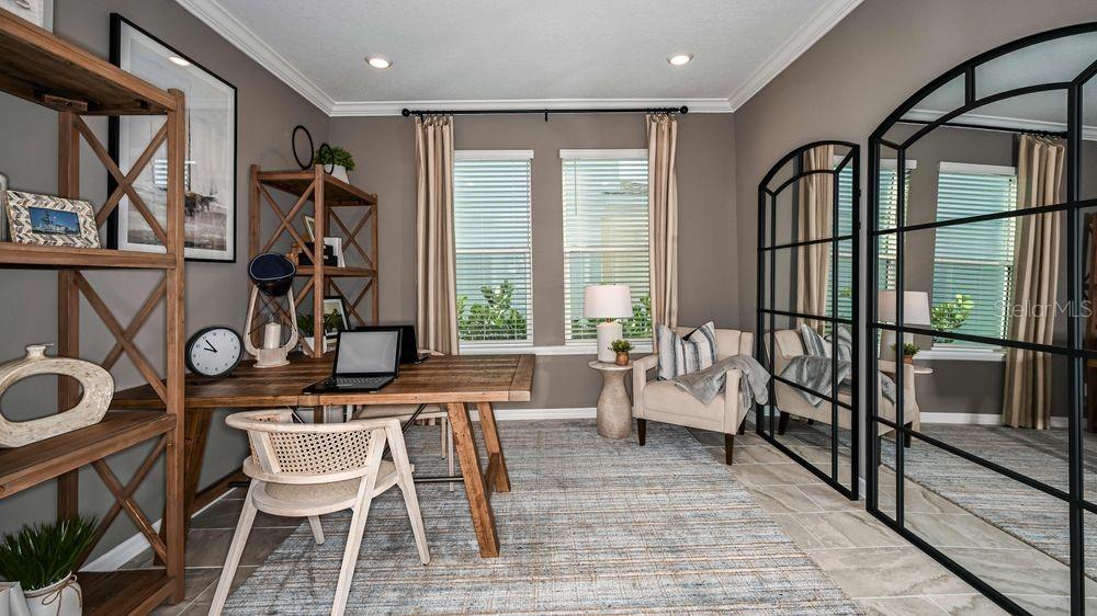 A home office features a wooden desk, a chair, shelving, and large arched wall mirrors — 15532 FOXTAIL LANE, NOKOMIS, FL