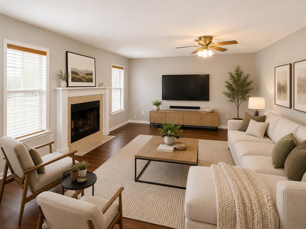 An empty dining room features wood-look flooring, light gray walls, and a hanging chandelier — 4104 QUAIL NEST COURT, ST CLOUD, FL