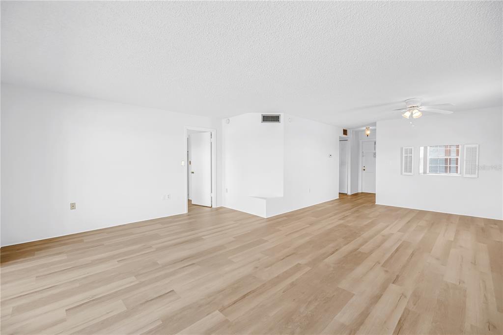 A kitchen features vintage light green cabinets, a yellow sink, and a drop ceiling — 1900 68TH STREET N UNIT 210, ST PETERSBURG, FL