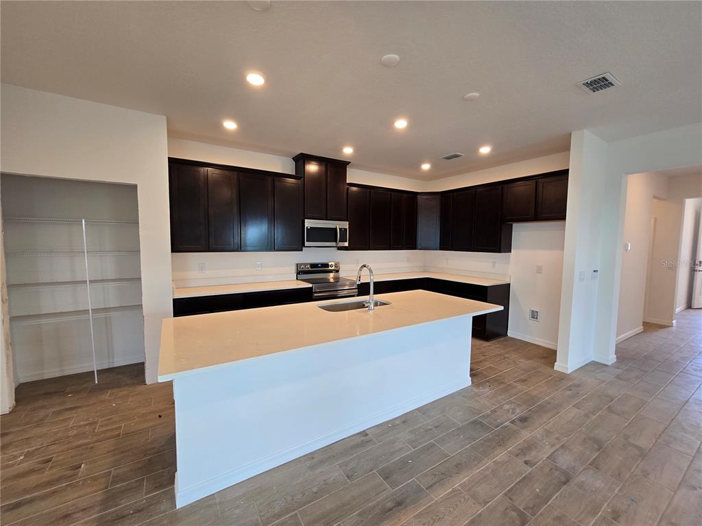 This is a floor plan for a house featuring four bedrooms, a garage, and a lanai — 6470 CHORUS DRIVE, MASCOTTE, FL