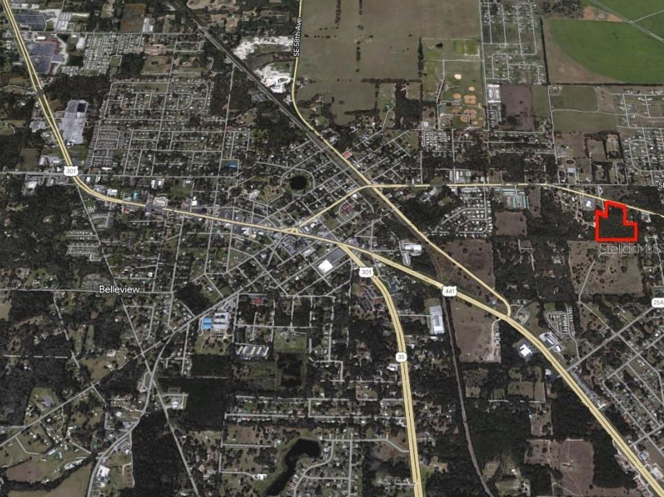 An aerial map view shows a red-outlined property located east of Belleview, Florida — 7200 E HIGHWAY 25, BELLEVIEW, FL