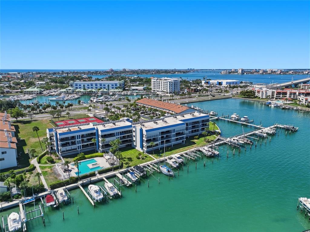 A balcony view overlooking a marina with several boats docked in the water — 363 PINELLAS BAYWAY S UNIT 29, TIERRA VERDE, FL
