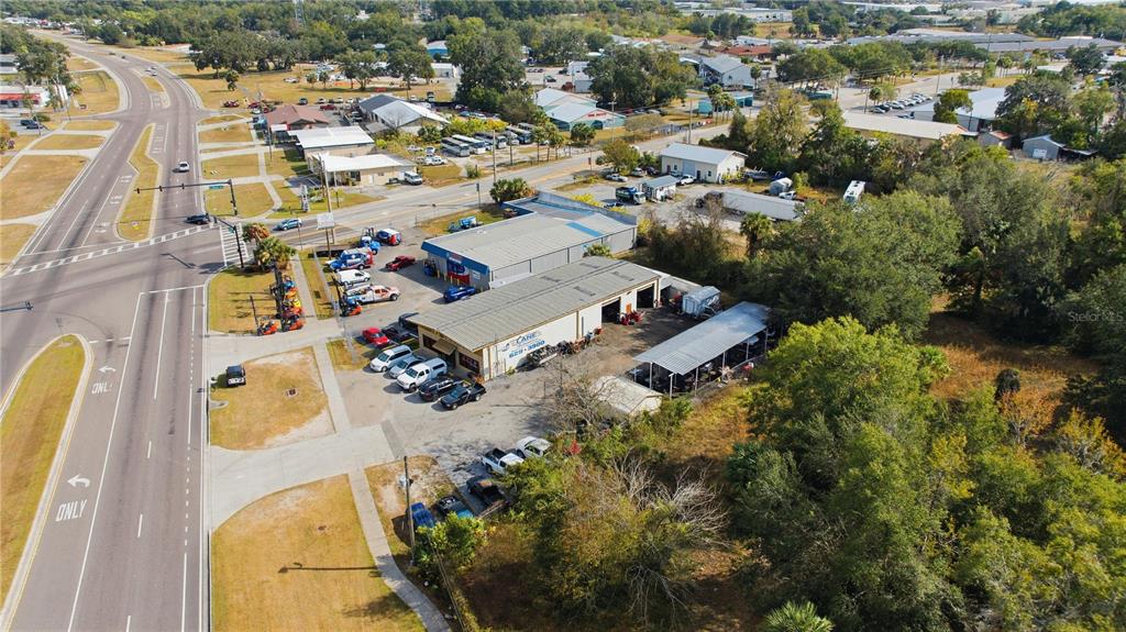An aerial view shows a commercial property with two warehouse buildings and a parking lot — 212 NW 20TH STREET, OCALA, FL