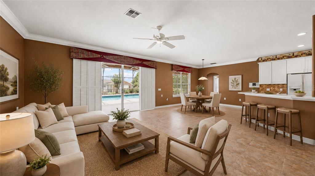 A bright entryway features tile flooring, a double front door, and a high ceiling — 1620 MARINA LAKE DR, KISSIMMEE, FL