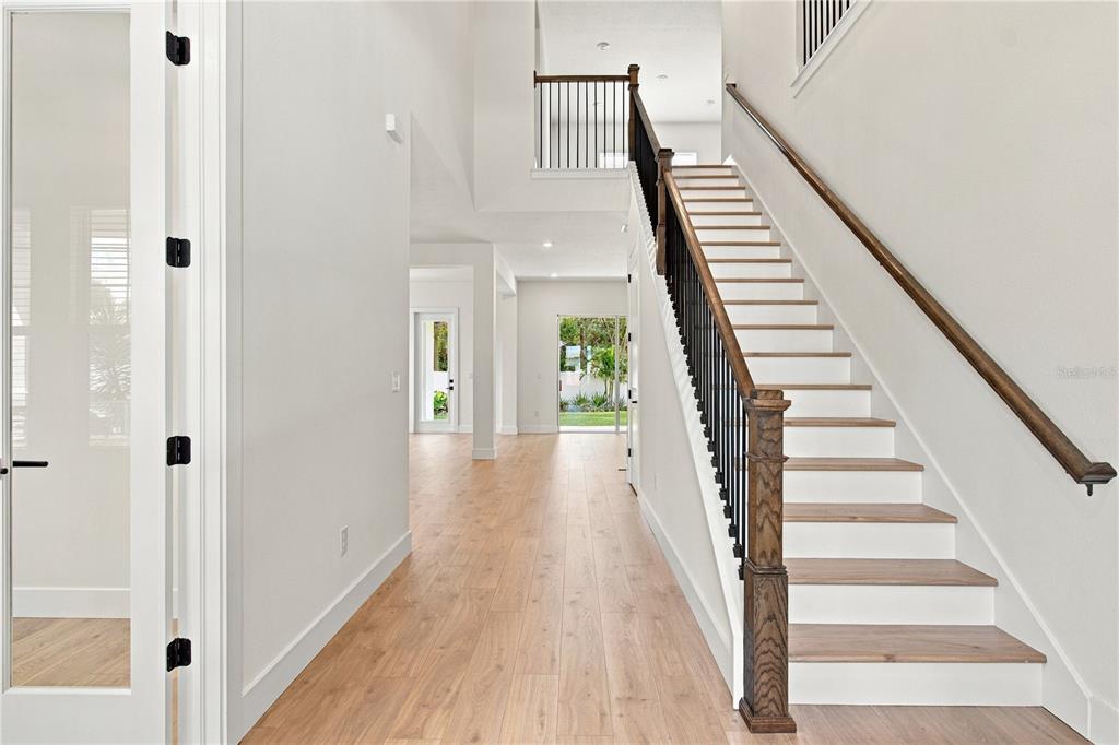 This is a digital rendering of a two-story house with a white exterior and garage — 812 W ORIENT STREET, TAMPA, FL