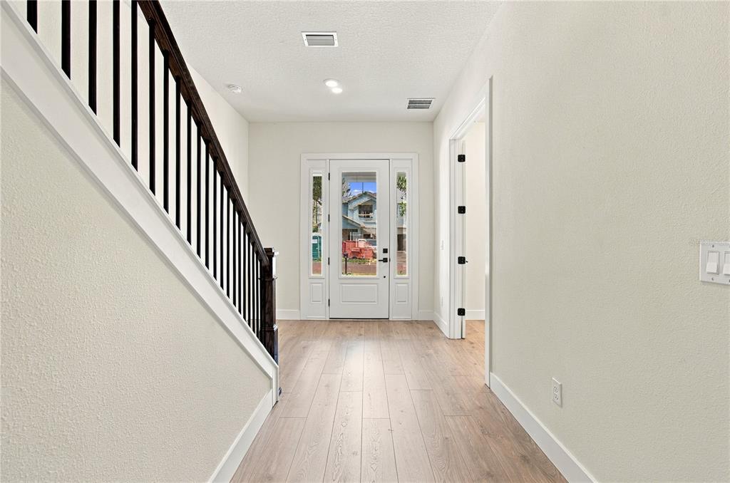 This floor plan shows a ground-level layout featuring a kitchen, family room, study, and garage — 812 W ORIENT STREET, TAMPA, FL