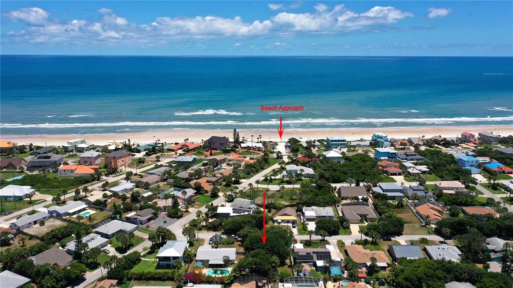 An aerial view shows a coastal neighborhood with houses, trees, and a beach access path — 4714 MONTROSE AVENUE, PONCE INLET, FL