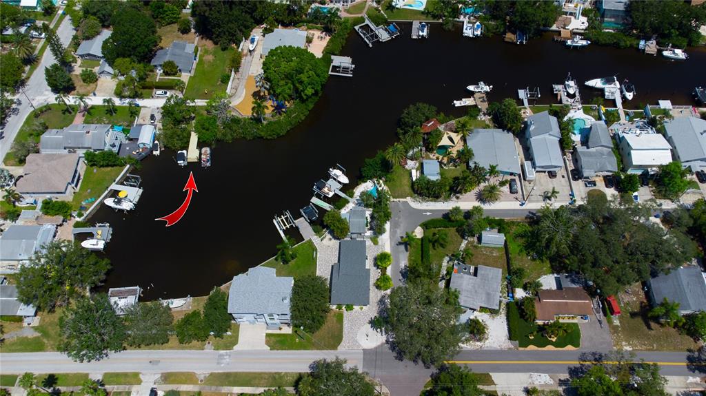 A view from the deck of a pontoon boat looking out over a calm canal — TENNESSEE AVENUE, CRYSTAL BEACH, FL