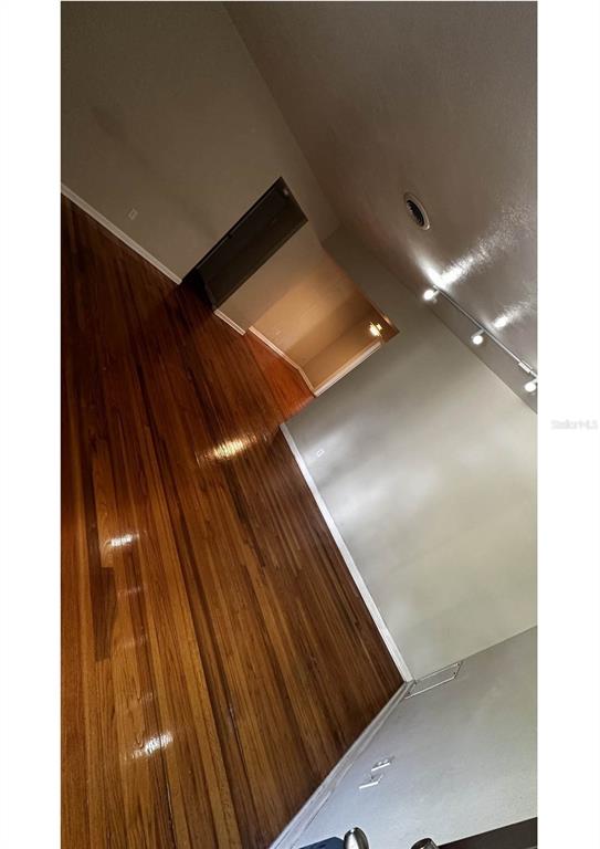A dining room with hardwood floors, a hanging light fixture, and white French doors — 2014 LINDA STREET, ORLANDO, FL