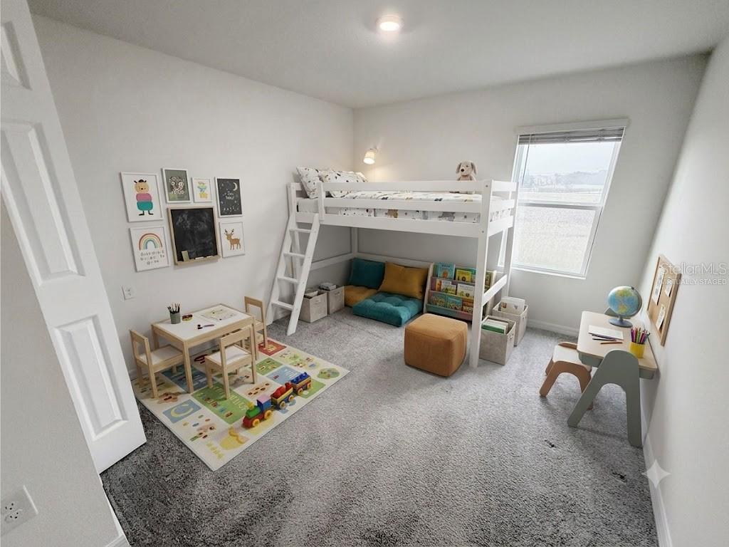 A child's bedroom features a white loft bed, a small table, and a play area — 288 TOWNS CIRCLE, HAINES CITY, FL