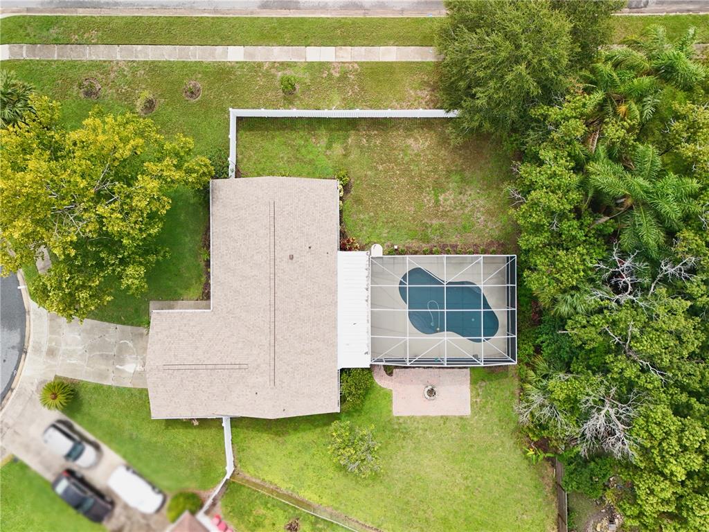 An aerial view shows a house with a screened-in pool and a large backyard — 5331 OAK COURT, WINTER PARK, FL