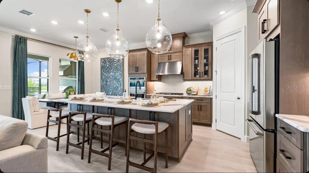 This image is a digital rendering showing ten samples of interior finishes, including flooring and tiles — 7636 MOONBEAM AVENUE, SARASOTA, FL