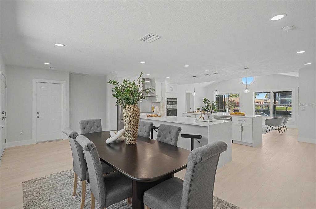 An aerial view of a house with a tiled roof, swimming pool, and screened lanai — 3340 FLORAMAR TERRACE, NEW PORT RICHEY, FL