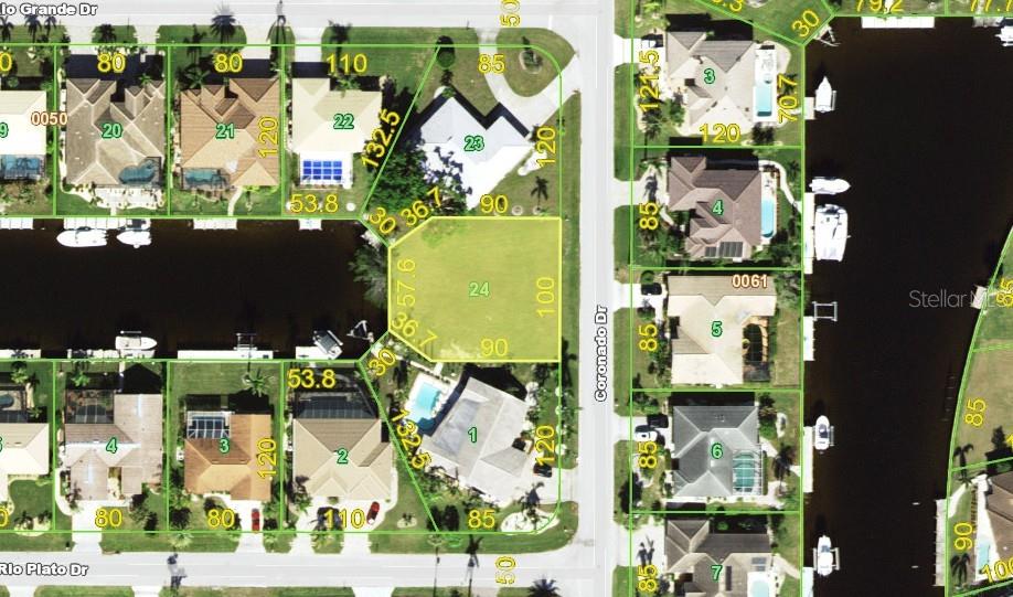 This is an aerial map showing residential lots and a canal in a neighborhood — 1121 CORONADO DRIVE, PUNTA GORDA, FL