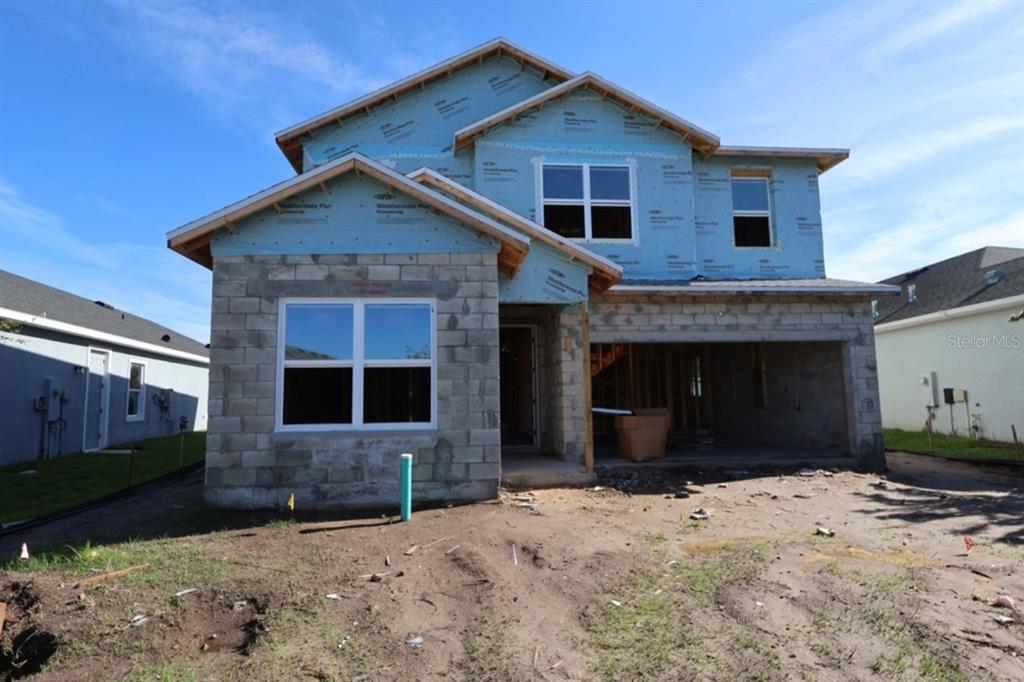 A two-story house under construction with concrete block walls and blue exterior sheathing — 5416 SILVER SUN DRIVE, APOLLO BEACH, FL