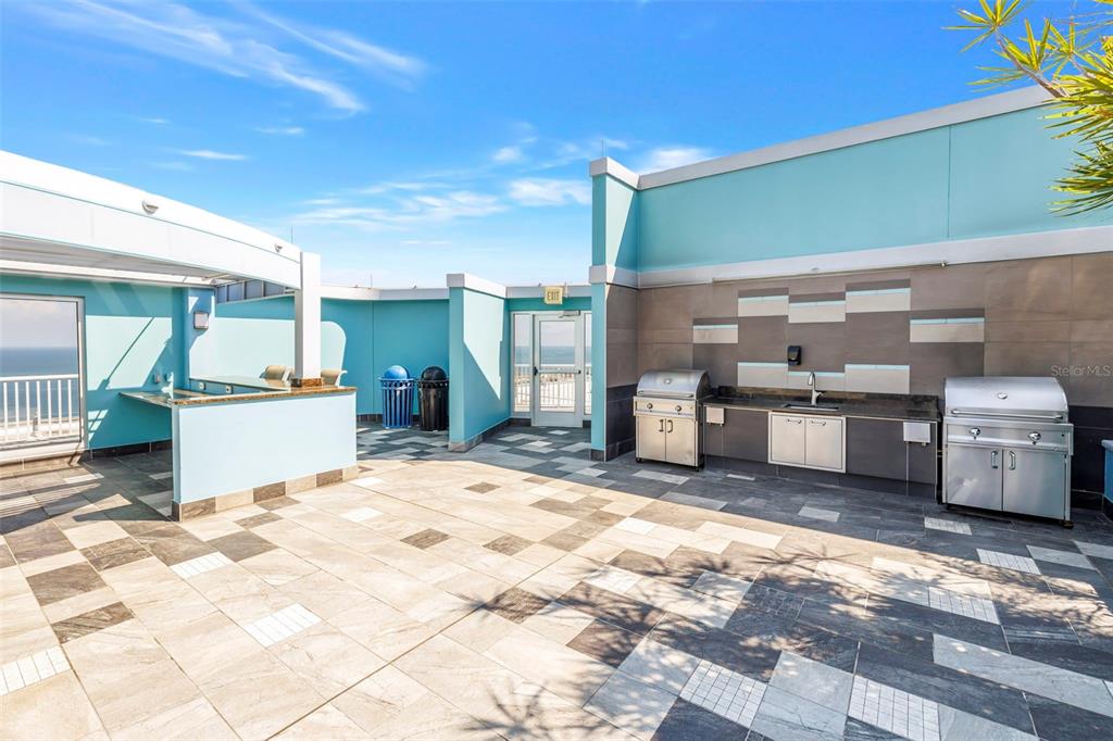 A view of a city street and high-rise buildings from a room with floor-to-ceiling windows — 1 BEACH DRIVE SE UNIT 1907, ST PETERSBURG, FL