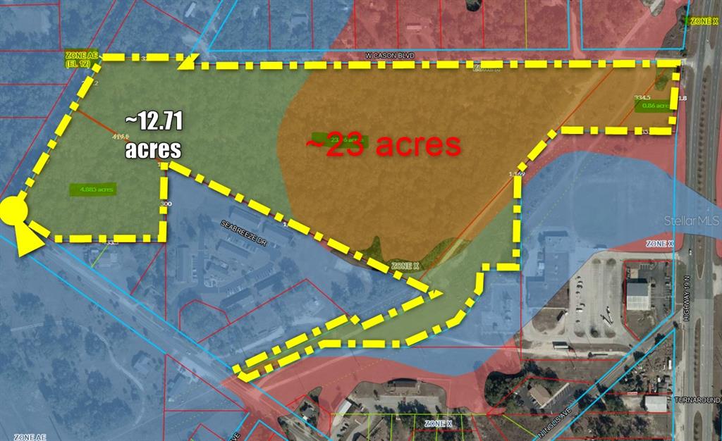 This map shows a land parcel outlined in yellow with acreage labels and flood zones — 0 S SUNCOAST BOULEVARD, INGLIS, FL