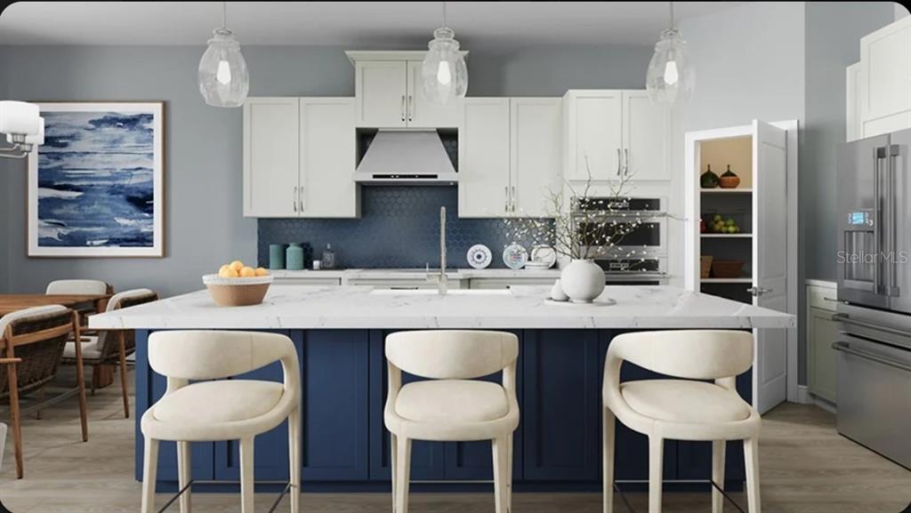 This is a rendering of a modern kitchen featuring a blue island and white cabinets — 10585 ECLIPSE STREET, SARASOTA, FL