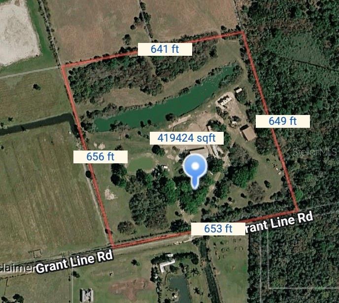 This is an aerial map showing a rectangular property with a pond and several buildings — 3100 GRANTLINE ROAD, MIMS, FL