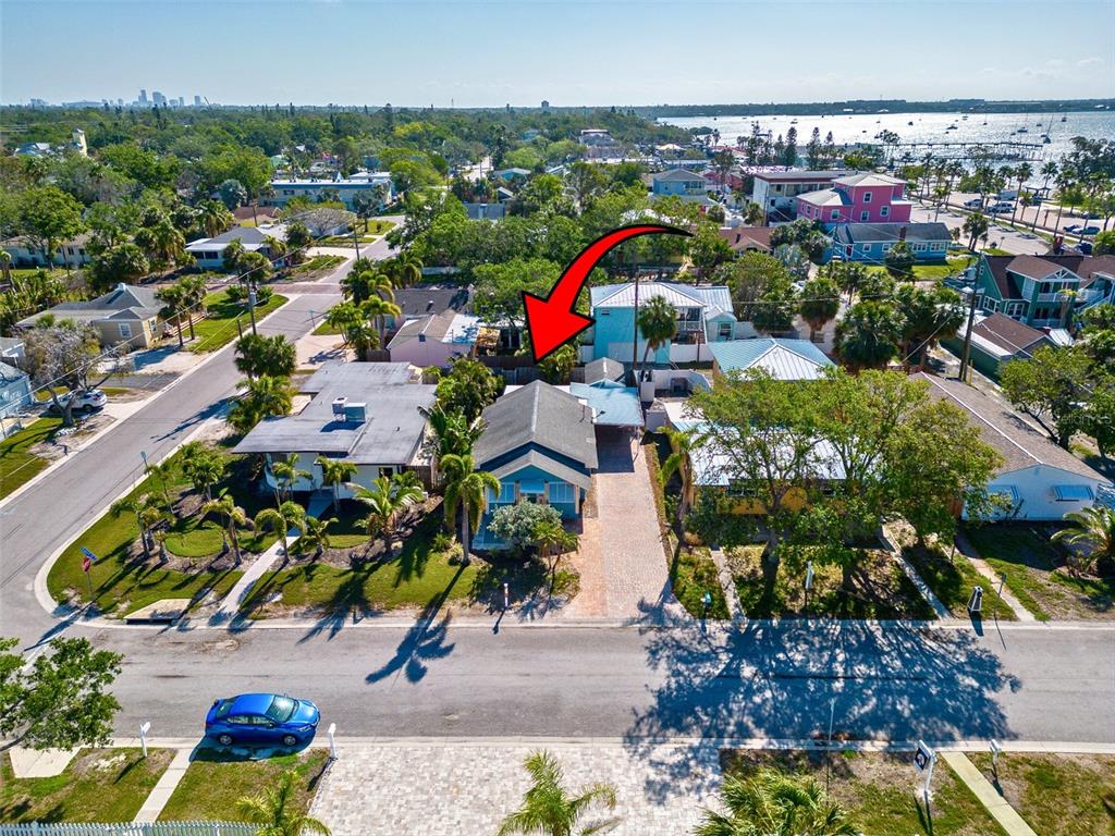 An aerial view shows a residential street with houses, palm trees, and a red arrow — 3108 DUPONT STREET S, GULFPORT, FL